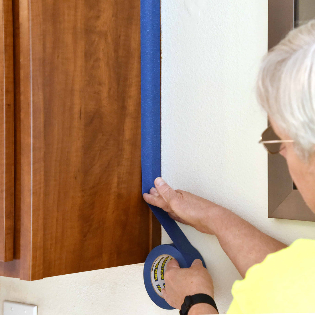 Painter's tape protects edges and non-painting areas.
